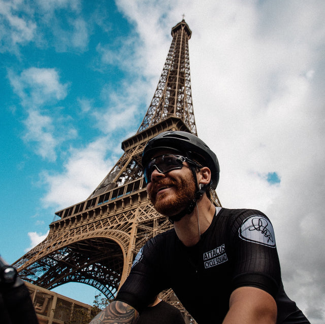 Chris Hall by the Eiffel Tower after cycling from London to Paris in under 10 hours