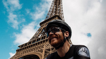 Chris Hall by the Eiffel Tower after cycling from London to Paris in under 10 hours